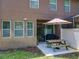 Back patio with outdoor seating and a grill, perfect for relaxation and entertaining at 1551 Peterson Pl, Sanford, FL 32773