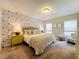 The main bedroom features neutral decor, carpet flooring, and two windows at 1551 Peterson Pl, Sanford, FL 32773