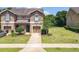 Charming front exterior of a two-story home with a well-manicured lawn and inviting curb appeal at 1551 Peterson Pl, Sanford, FL 32773