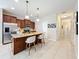 Kitchen with granite island, stainless steel appliances, and open layout at 1551 Peterson Pl, Sanford, FL 32773