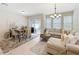 Comfortable living room features a large sectional sofa, neutral decor, and outdoor access to a patio at 1551 Peterson Pl, Sanford, FL 32773