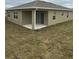 Back exterior view of home featuring a covered patio at 1575 Aspen Ave, Davenport, FL 33837