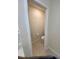 Small half-bathroom featuring a standard toilet and tan walls at 1575 Aspen Ave, Davenport, FL 33837