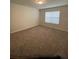 Comfortable bedroom with plush carpeting, offering a serene and inviting atmosphere at 1575 Aspen Ave, Davenport, FL 33837