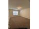 Inviting bedroom featuring carpeted floors and large window providing natural light, for peaceful relaxation at 1575 Aspen Ave, Davenport, FL 33837