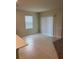 Dining area with tiled flooring and sliding doors, seamlessly connected to kitchen at 1575 Aspen Ave, Davenport, FL 33837