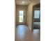 Tiled entryway featuring a front door with a glass pane at 1575 Aspen Ave, Davenport, FL 33837