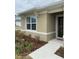 Close-up of the front entry, showcasing the exterior and landscaping at 1575 Aspen Ave, Davenport, FL 33837