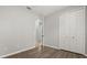 Bedroom features wood flooring, neutral walls, and a closet with doors at 1601 Stargazer Ter, Sanford, FL 32771