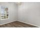 Bedroom featuring wood flooring, neutral walls, and a window providing natural light at 1601 Stargazer Ter, Sanford, FL 32771