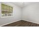 Bedroom features wood flooring, neutral walls, a window providing natural light at 1601 Stargazer Ter, Sanford, FL 32771