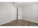 Bedroom featuring wood flooring, neutral walls, and a closet with doors at 1601 Stargazer Ter, Sanford, FL 32771