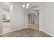 Bright dining area with wood-look floors and an arched entryway to the kitchen at 1601 Stargazer Ter, Sanford, FL 32771
