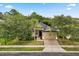 Charming single-story home featuring a brick driveway, lush landscaping, and a two-car garage at 1601 Stargazer Ter, Sanford, FL 32771