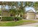 Beautiful home boasts a brick driveway, lush landscaping, and an attached two-car garage at 1601 Stargazer Ter, Sanford, FL 32771