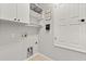 A well-organized laundry room with shelving, storage, and laundry hookups at 1601 Stargazer Ter, Sanford, FL 32771