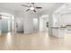 Bright, open living space features tile flooring, arched doorways, and a ceiling fan at 1601 Stargazer Ter, Sanford, FL 32771