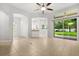 Spacious living area featuring tile floors, a ceiling fan, and access to the backyard at 1601 Stargazer Ter, Sanford, FL 32771