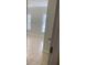 This bedroom has neutral tile and two windows with blinds for natural light at 2007 Dixie Belle Dr # 2007 M, Orlando, FL 32812