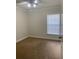 This bedroom features neutral carpet and a window with blinds for natural light at 2007 Dixie Belle Dr # 2007 M, Orlando, FL 32812