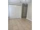 Neutral bedroom with tiled floors and a large closet for ample storage space at 2007 Dixie Belle Dr # 2007 M, Orlando, FL 32812
