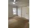 Bedroom with a ceiling fan and spacious closet for organized storage at 2007 Dixie Belle Dr # 2007 M, Orlando, FL 32812