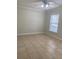 This bedroom offers neutral tile and a ceiling fan with overhead lighting at 2007 Dixie Belle Dr # 2007 M, Orlando, FL 32812