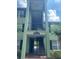 Exterior shot of condo stairs, showing railings, balconies, and painted stairs at 2007 Dixie Belle Dr # 2007 M, Orlando, FL 32812