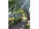 Landscaped walkway with lush greenery leading to charming apartments in a serene setting at 2007 Dixie Belle Dr # 2007 M, Orlando, FL 32812