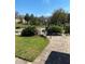 Grounds offer a landscaped walkway that leads to lush green spaces and community amenities at 2007 Dixie Belle Dr # 2007 M, Orlando, FL 32812