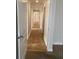 Hallway with stone tile and white trim creating a seamless flow throughout the home at 2007 Dixie Belle Dr # 2007 M, Orlando, FL 32812