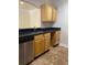 Kitchen with stainless steel dishwasher and light wood cabinetry offering ample storage at 2007 Dixie Belle Dr # 2007 M, Orlando, FL 32812