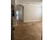 Inviting living room with tan flooring and access to kitchen and hallway at 2007 Dixie Belle Dr # 2007 M, Orlando, FL 32812