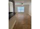 Inviting living room boasts a ceiling fan, a large window and neutral paint throughout at 2007 Dixie Belle Dr # 2007 M, Orlando, FL 32812