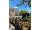 Community pool with lounge seating surrounded by landscaping at 2007 Dixie Belle Dr # 2007 M, Orlando, FL 32812