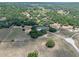 Aerial shot of the property nestled among mature trees in a private setting at 20199 Sweetwood Ln, Clermont, FL 34715