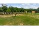 Backyard game area with wooded surroundings and axe throwing station at 20199 Sweetwood Ln, Clermont, FL 34715