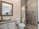 Bathroom featuring a modern sink bowl, toilet and walk-in shower with decorative curtain at 20199 Sweetwood Ln, Clermont, FL 34715