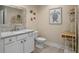 Coastal themed bathroom with decorative accents, vanity, and beach-inspired artwork at 20199 Sweetwood Ln, Clermont, FL 34715