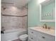 Bathroom featuring a tub shower combination with a white vanity at 20199 Sweetwood Ln, Clermont, FL 34715