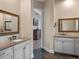 Spacious bathroom featuring double vanities with granite countertops and slate flooring at 20199 Sweetwood Ln, Clermont, FL 34715
