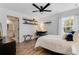 Bedroom with coastal decor, natural light, and a desk with a view at 20199 Sweetwood Ln, Clermont, FL 34715