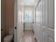 Hallway with access to a bathroom, laundry area, and closet space at 20199 Sweetwood Ln, Clermont, FL 34715