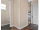 Hallway with a half bath, stacked stone accent wall, and an interior door at 20199 Sweetwood Ln, Clermont, FL 34715