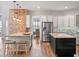 Well-lit kitchen features stainless steel appliances, contrasting islands, and a brick accent wall at 20199 Sweetwood Ln, Clermont, FL 34715