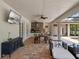 Charming outdoor patio with a dining area, outdoor kitchen and comfortable seating at 20199 Sweetwood Ln, Clermont, FL 34715