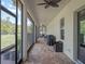 Extended covered patio perfect for outdoor entertainment and enjoying backyard views at 20199 Sweetwood Ln, Clermont, FL 34715