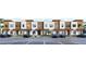 Contemporary townhouses with a neatly arranged parking area and appealing architectural design at 213 Breezeway Dr, Davenport, FL 33897