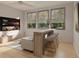 Stylish living room featuring a tv, bar seating, and lots of natural light at 213 Breezeway Dr, Davenport, FL 33897