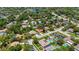 An aerial view of the residential area, with mature landscaping, a lake nearby, and well-kept lawns at 226 Selkirk Way, Longwood, FL 32779